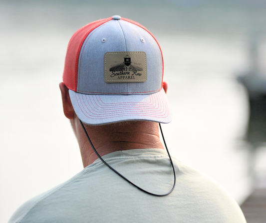 Grey hat with red mesh back. Laser engraved faux leather patch featuring Southern Row Apparel logo